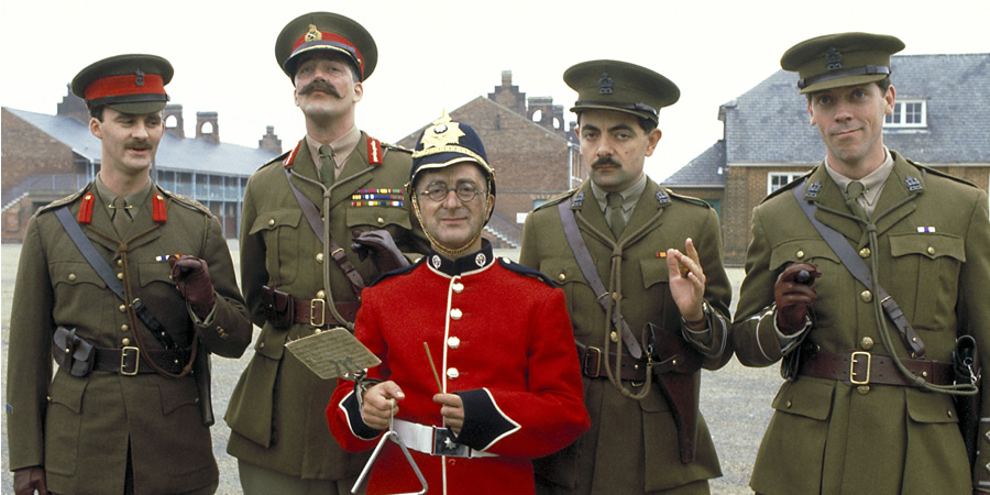 Blackadder. Image shows from L to R: Captain Kevin Darling (Tim McInnerny), Lord Melchett (Stephen Fry), Baldrick (Tony Robinson), Captain Edmund Blackadder (Rowan Atkinson), Lieutenant George Barleigh (Hugh Laurie)