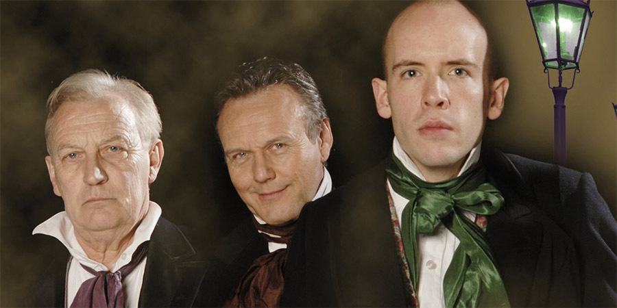 Bleak Expectations. Image shows from L to R: Grimpunch (Geoffrey Whitehead), Mr Gently Benevolent (Anthony Head), Young Pip (Tom Allen). Copyright: BBC