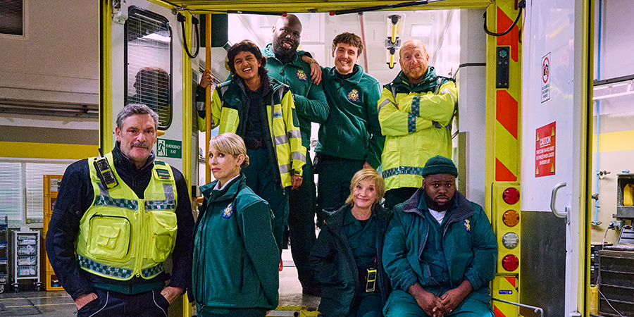 Bloods. Image shows from L to R: Lawrence (Julian Barratt), Jo (Lucy Punch), Kareshma (Aasiya Shah), Darryl (Kevin Garry), Darrell (Sam Campbell), Wendy (Jane Horrocks), Gary (Adrian Scarborough), Maleek (Samson Kayo)