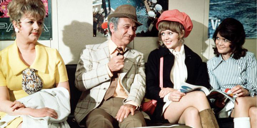 Carry On Abroad. Image shows from L to R: Cora Flange (Joan Sims), Vic Flange (Sid James), Marge (Carol Hawkins), Lily Mays (Sally Geeson). Copyright: Peter Rogers Productions