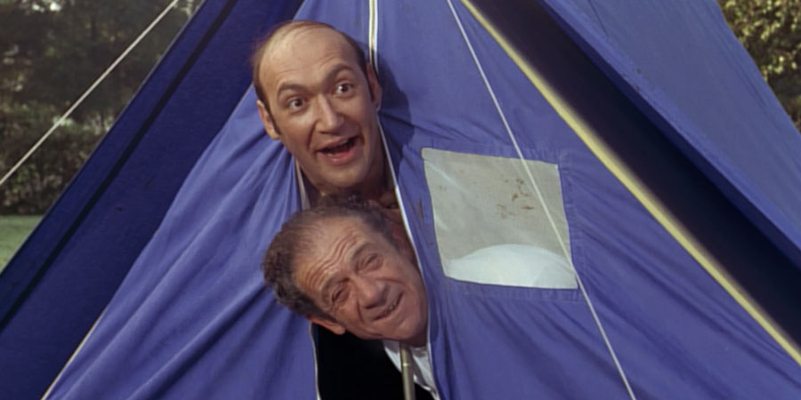 Carry On Camping. Image shows from L to R: Bernie Lugg (Bernard Bresslaw), Sid Boggle (Sid James). Copyright: ITV Studios