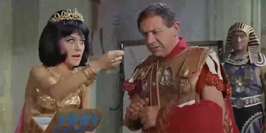 Carry On Cleo. Image shows left to right: Cleopatra (Amanda Barrie), Mark Antony (Sid James)