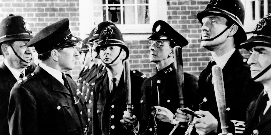 Carry On, Constable. Image shows left to right: Sergeant Frank Wilkins (Sid James), Inspector Mills (Eric Barker), Constable Stanley Benson (Kenneth Williams), Special Constable Timothy Gorse (Charles Hawtrey), Constable Tom Potter (Leslie Phillips), Constable Charlie Constable (Kenneth Connor). Credit: STUDIOCANAL