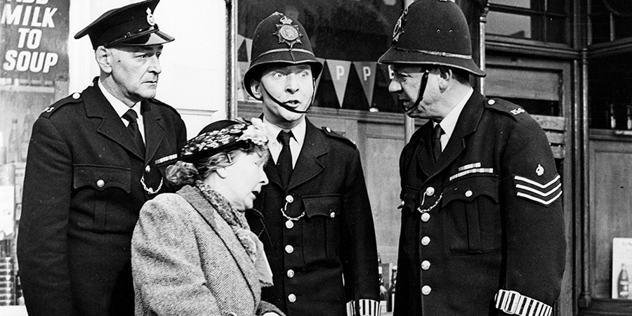 Carry On, Constable. Image shows left to right: Constable Thurston (Cyril Chamberlain), Deaf Lady (Esma Cannon), Constable Benson (Kenneth Williams), Sgt. Frank Wilkins (Sid James). Credit: STUDIOCANAL