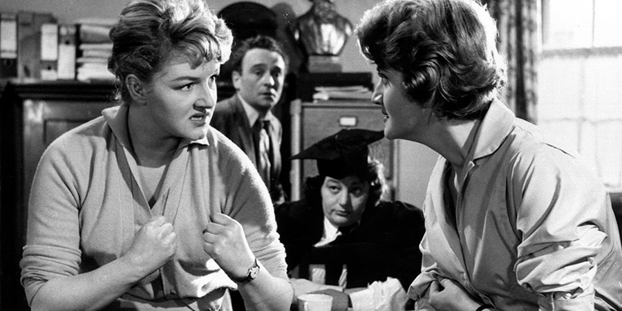 Carry On Teacher. Image shows from L to R: Miss Sarah Allcock (Joan Sims), Mr. Gregory Adams (Kenneth Connor), Miss Grace Short (Hattie Jacques), Miss Felicity Wheeler (Rosalind Knight). Copyright: Peter Rogers Productions / STUDIOCANAL