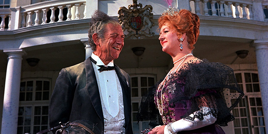 Carry On... Up The Khyber. Image shows from L to R: Sir Sidney Ruff-Diamond (Sid James), Lady Ruff-Diamond (Joan Sims). Copyright: Peter Rogers Productions