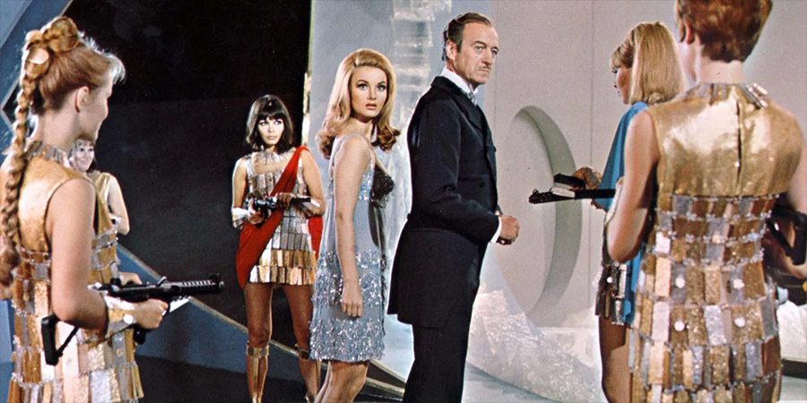 Casino Royale. Image shows left to right: Moneypenny (Barbara Bouchet), Sir James Bond (David Niven)