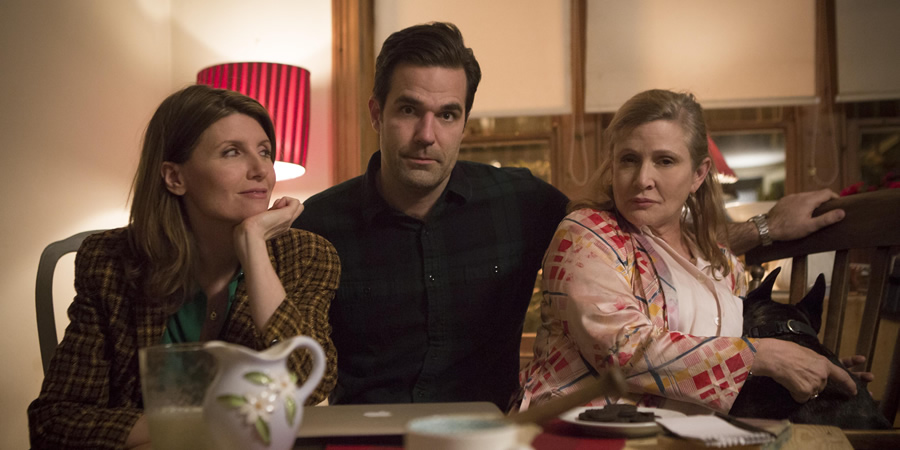 Catastrophe. Image shows from L to R: Sharon (Sharon Horgan), Rob (Rob Delaney), Mia (Carrie Fisher). Copyright: Avalon Television