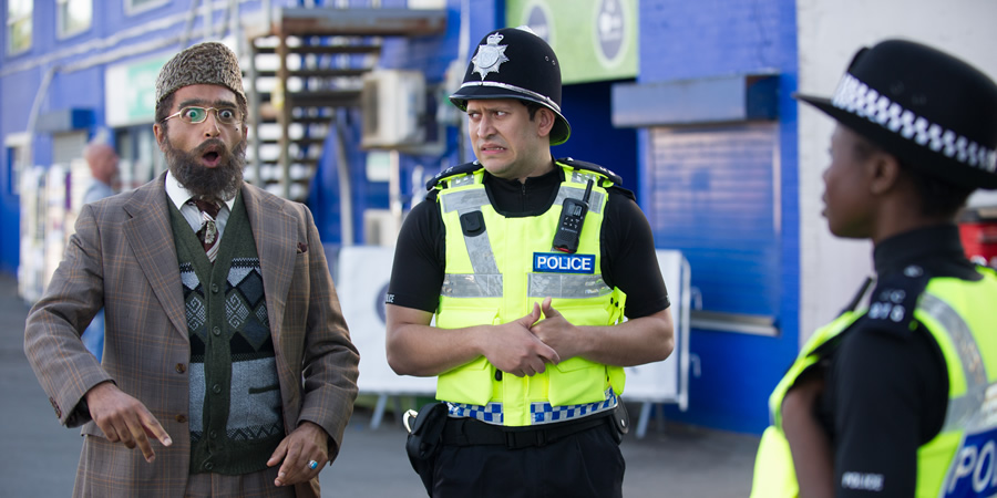 Citizen Khan. Image shows from L to R: Mr Khan (Adil Ray), Amjad (Abdullah Afzal). Copyright: BBC