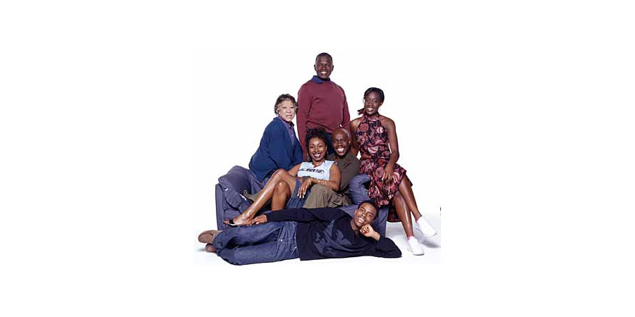 The Crouches. Image shows from L to R: Grandma Sylvie Crouch (Mona Hammond), Natalie Crouch (Jo Martin), Grandpa Langley Crouch (Rudolph Walker), Roly Crouch (Robbie Gee), Aiden Crouch (Akemnji Ndifornyen), Adele Crouch (Ony Uhiara). Copyright: BBC