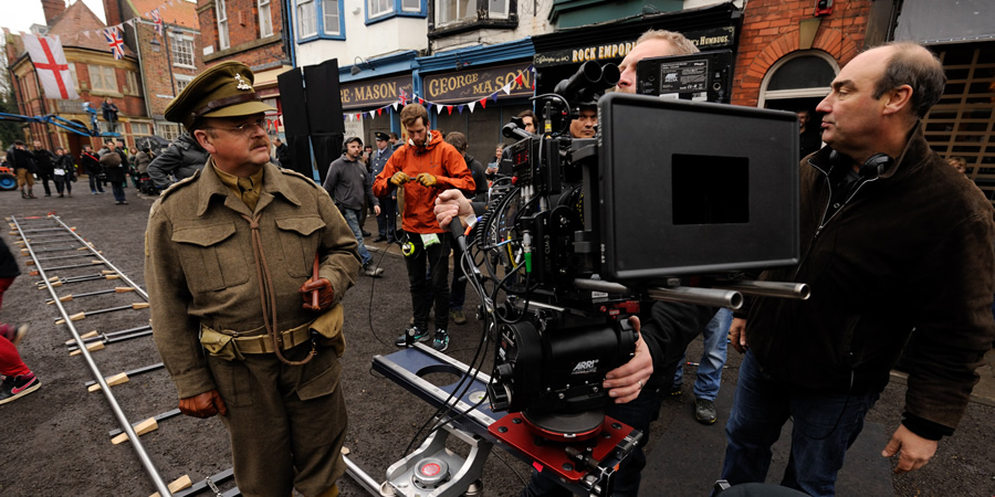 Dad's Army. Image shows from L to R: Captain George Mainwaring (Toby Jones), Oliver Parker. Copyright: Universal Pictures / DJ Films