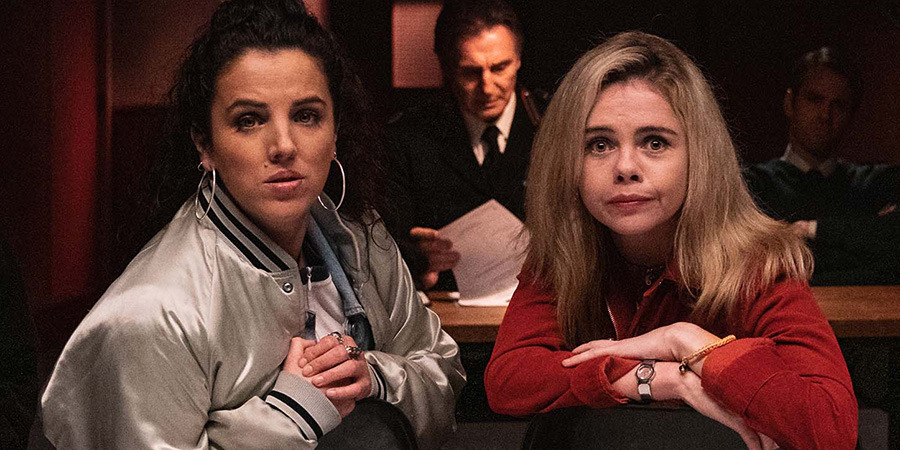 Derry Girls. Image shows left to right: Michelle Mallon (Jamie-Lee O'Donnell), Erin Quinn (Saoirse-Monica Jackson). Credit: Hat Trick Productions