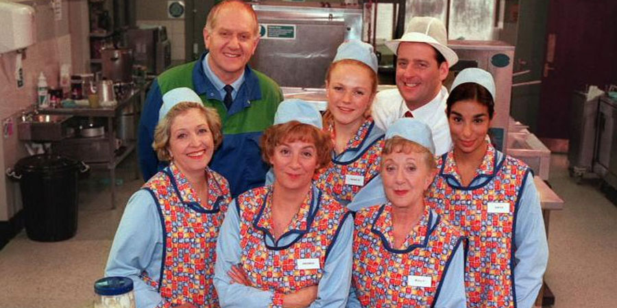 dinnerladies. Image shows from L to R: Jean (Anne Reid), Stan (Duncan Preston), Brenda (Victoria Wood), Twinkle (Maxine Peake), Dolly (Thelma Barlow), Tony (Andrew Dunn), Anita (Shobna Gulati). Copyright: Good Fun / Pozzitive Productions