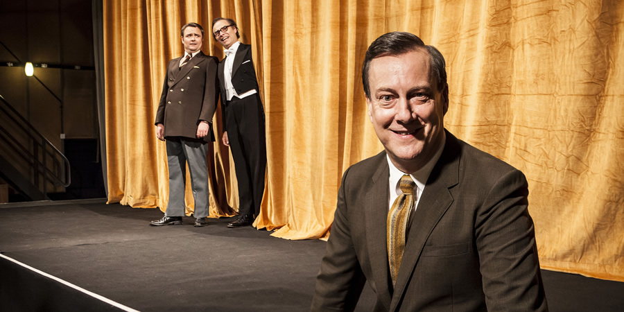 Eric, Ernie And Me. Image shows from L to R: Ernie Wise (Neil Maskell), Eric Morecambe (Mark Bonnar), Eddie Braben (Stephen Tompkinson). Copyright: Objective Productions