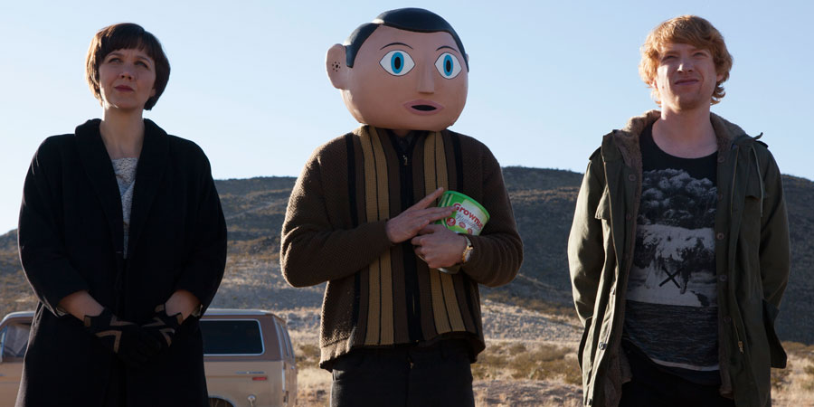 Frank. Image shows from L to R: Clara (Maggie Gyllenhaal), Frank Sidebottom (Michael Fassbender), Jon Burroughs (Domhnall Gleeson). Copyright: Film4