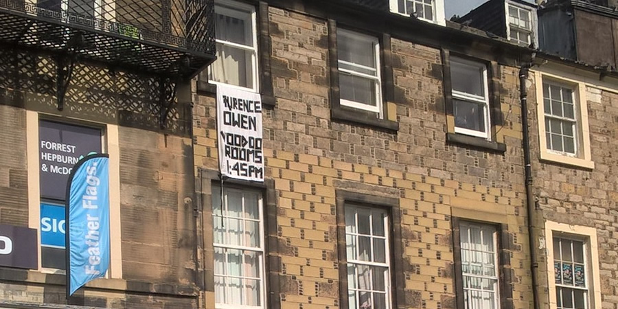 Laurence Owen has put a bedsheet out his window to promote his show. Copyright: BCG