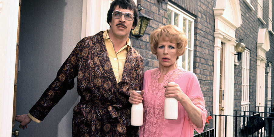 George & Mildred. Image shows from L to R: Jeffrey Fourmile (Norman Eshley), Mildred Roper (Yootha Joyce). Copyright: Thames Television