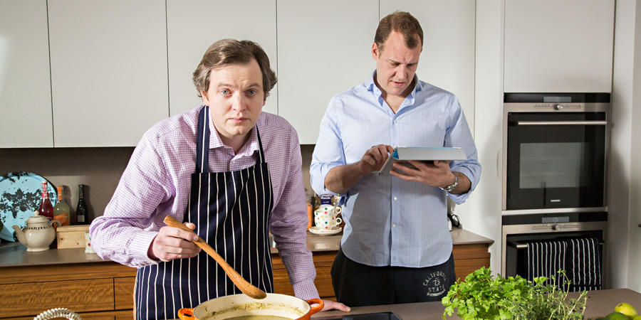 In And Out Of The Kitchen. Image shows from L to R: Damien Trench (Miles Jupp), Anthony McIlvanney (Justin Edwards). Copyright: BBC