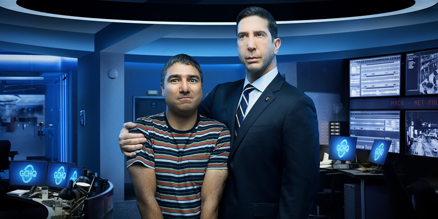 Intelligence. Image shows from L to R: Joseph Harries (Nick Mohammed), Jerry Bernstein (David Schwimmer)