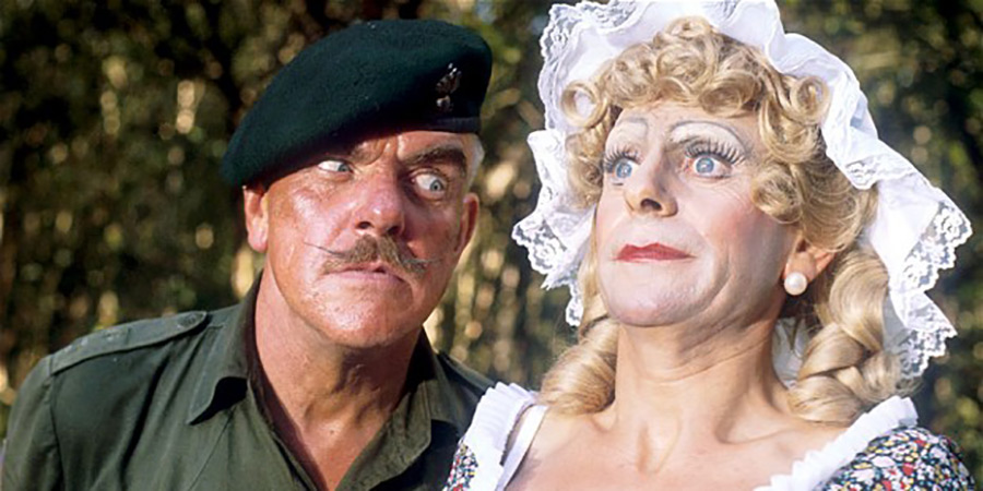 It Ain't Half Hot Mum. Image shows left to right: BSM Geoffrey 'Shut Up' Williams (Windsor Davies), Bombardier 'Gloria' Beaumont (Melvyn Hayes). Credit: BBC