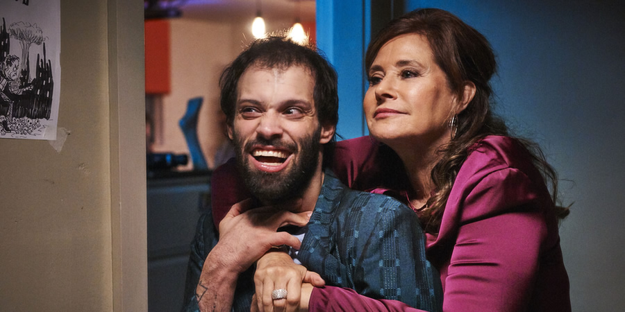 Jerk. Image shows from L to R: Tim (Tim Renkow), Tim's Mom (Lorraine Bracco)