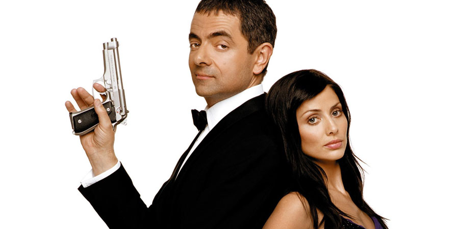Johnny English. Image shows from L to R: Johnny English (Rowan Atkinson), Lorna Campbell (Natalie Imbruglia). Copyright: Working Title Films / STUDIOCANAL