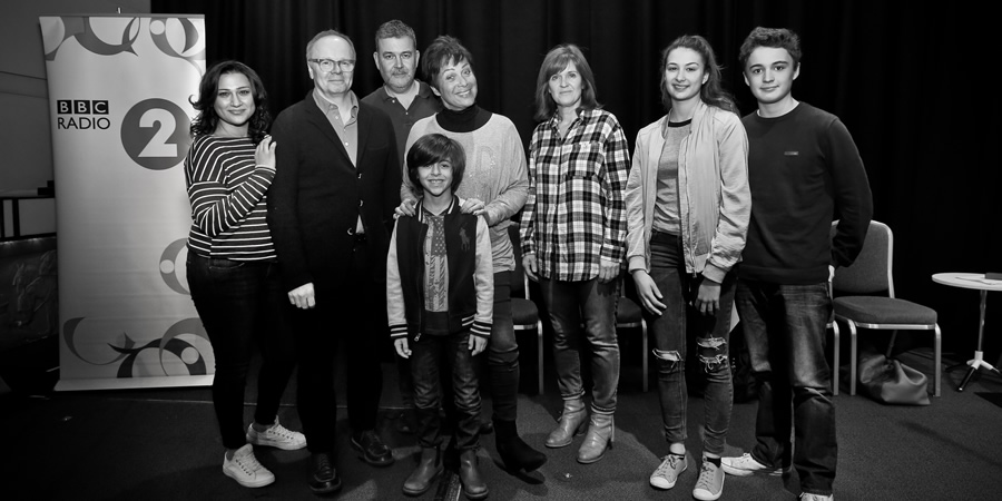 Just Grand. Image shows from L to R: Padma (Chetna Pandya), Frank (Jason Watkins), Thommo (Phil Mealey), Gloria (Denise Welch), Marcus (Ben Greaves-Neal), Sandra (Siobhan Finneran), Poppy (Kate Sale), Ollie (Toby Ungelson). Copyright: BBC