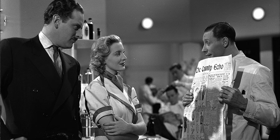 Keep Fit. Image shows from L to R: Hector Kent (Guy Middleton), Joan Allen (Kay Walsh), George Green (George Formby). Copyright: Associated Talking Pictures