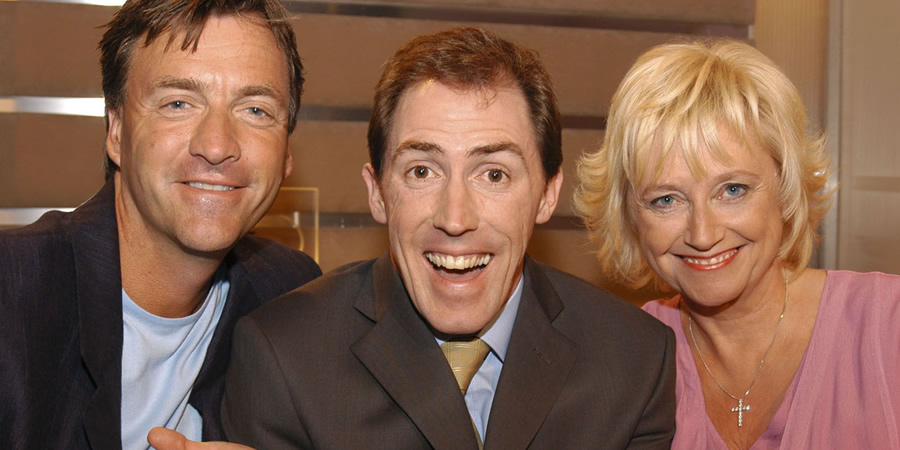 The Keith Barret Show. Image shows from L to R: Richard Madeley, Keith Barret (Rob Brydon), Judy Finnigan