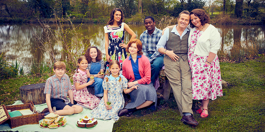 The Larkins. Image shows from L to R: Montgomery Larkin (Liam Middleton), Petunia Larkin (Rosie Coleman), Victoria Larkin (Lola Shepelev), Zinnia Larkin (Davina Coleman), Mariette Larkin (Sabrina Bartlett), Primrose Larkin (Lydia Page), Cedric 'Charley' Charlton (Tok Stephen), Pop Larkin (Bradley Walsh), Ma Larkin (Joanna Scanlan)