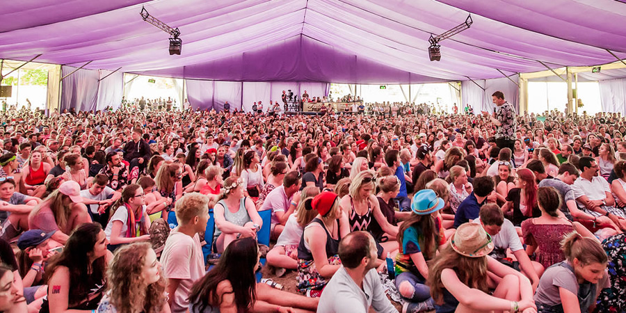 Joe Lycett walking through the audience at Latitude Festival 2016. Copyright: Latitude / Jen O'Neill