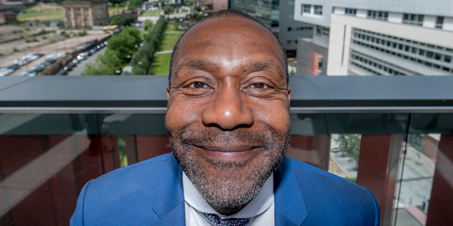 Birmingham City University Chancellor, Sir Lenny Henry, poses in front of the institution's City Centre Campus, from the balcony of the University's new £63 million Curzon Building. Lenny Henry. Copyright: Birmingham City University