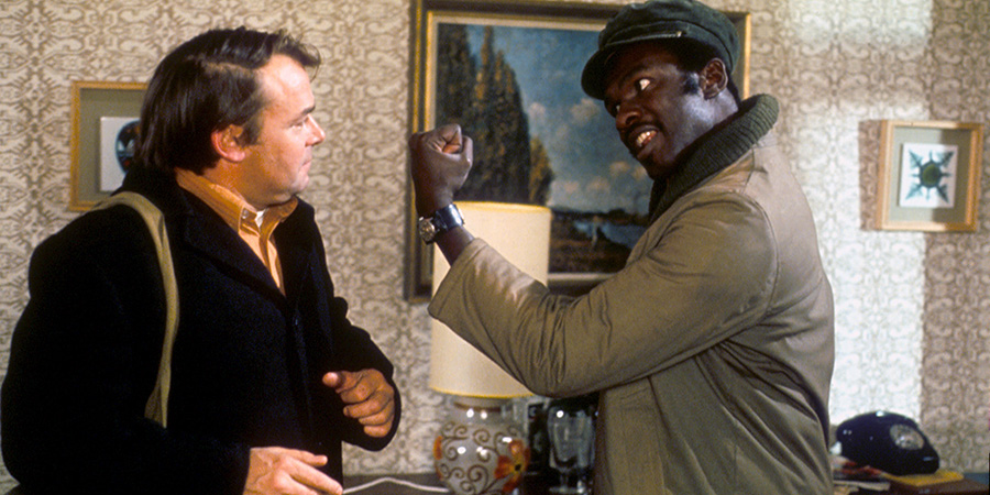 Love Thy Neighbour. Image shows left to right: Eddie Booth (Jack Smethurst), Bill Reynolds (Rudolph Walker)