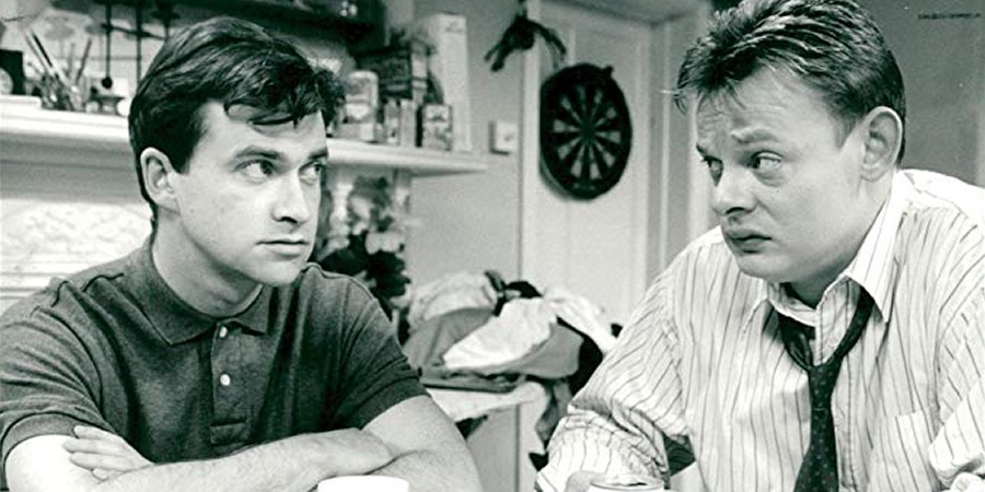 Men Behaving Badly. Image shows from L to R: Dermot (Harry Enfield), Gary Strang (Martin Clunes). Copyright: Hartswood Films Ltd