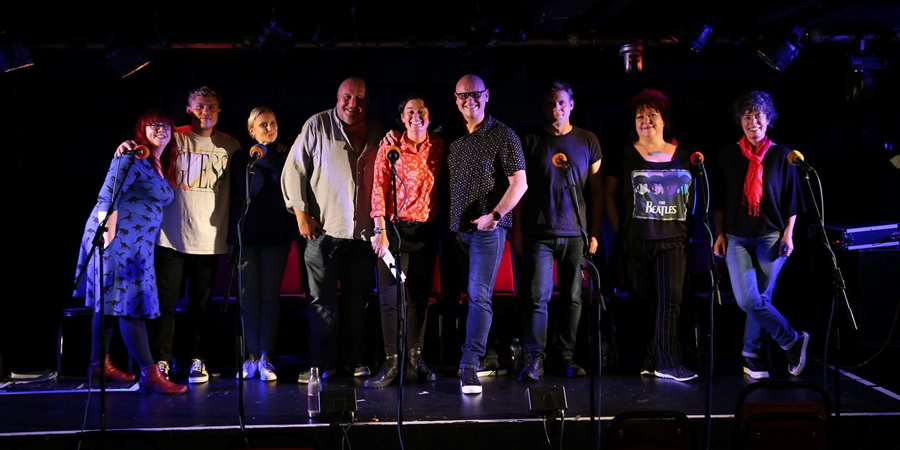 No Gods, No Golf. Image shows from L to R: Mel (Angela Barnes), Clive / Grayson (Jon Pointing), Alexa / Supermarket Woman (Jenny Bede), Patrick (Steve Speirs), Zoe (Zoe Lyons), Dicky / Chris Eubank / Max (Terry Alderton), Waiter / Award Winner (Michael Fabbri), Georgina (Sue Vincent), Freddie / Sharon (Selina Griffiths)