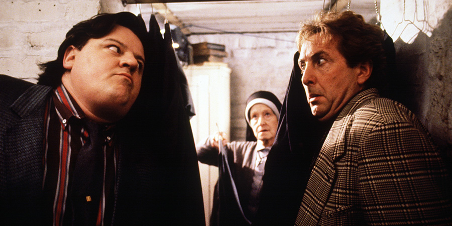 Nuns On The Run. Image shows left to right: Charlie McManus (Robbie Coltrane), Brian Hope (Eric Idle). Credit: Hand Made Films Nuns On The Run. Image shows left to right: Charlie McManus (Robbie Coltrane), Brian Hope (Eric Idle). Credit: Hand Made Films