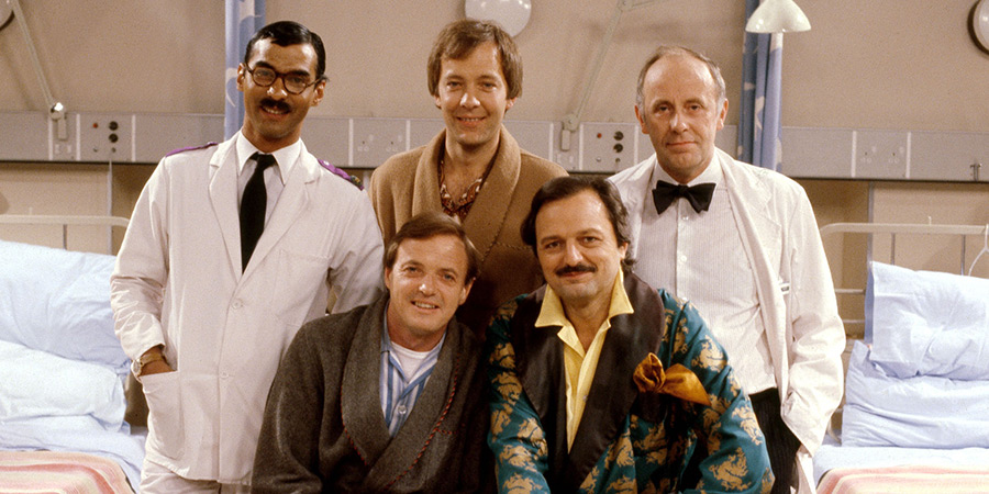 Only When I Laugh. Image shows left to right: Gupte (Derrick Branche), Roy Figgis (James Bolam), Norman Binns (Christopher Strauli), Archie Glover (Peter Bowles), Dr. Gordon Thorpe (Richard Wilson). Credit: Yorkshire Television, ITV