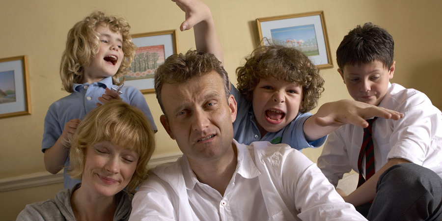 Outnumbered. Image shows from L to R: Karen (Ramona Marquez), Sue (Claire Skinner), Pete (Hugh Dennis), Ben (Daniel Roche), Jake (Tyger Drew-Honey). Copyright: Hat Trick Productions