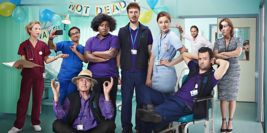 Porters. Image shows from L to R: Dr Batholomew (Sinead Keenan), Mr. Pradeep (Sanjeev Bhaskar), Tillman (Rutger Hauer), Frankie (Susan Wokoma), Simon Porter (Edward Easton), Lucy (Claudia Jessie), Dr. McKenzie (James Atherton), Anthony De La Mer (Daniel Mays), Jane Bison (Tanya Franks), Alice (Siobhán McSweeney)