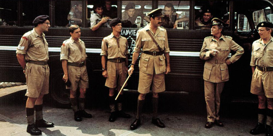 Privates On Parade. Image shows from L to R: Sergeant Eric Young-Love (Simon Jones), Sergeant Charles Bishop (David Bamber), Sergeant Steven Flowers (Patrick Pearson), Major Giles Flack (John Cleese), Acting Captain Terri Dennis (Denis Quilley). Copyright: Hand Made Films