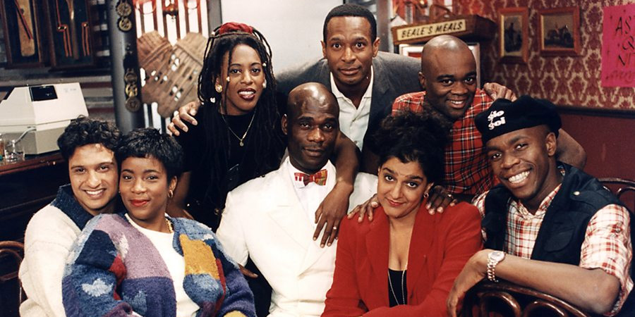 The Real McCoy. Image shows from L to R: Kulvinder Ghir, Llewella Gideon, Judith Jacob, Leo Chester, Felix Dexter, Meera Syal, Eddie Nestor, Robbie Gee. Copyright: BBC