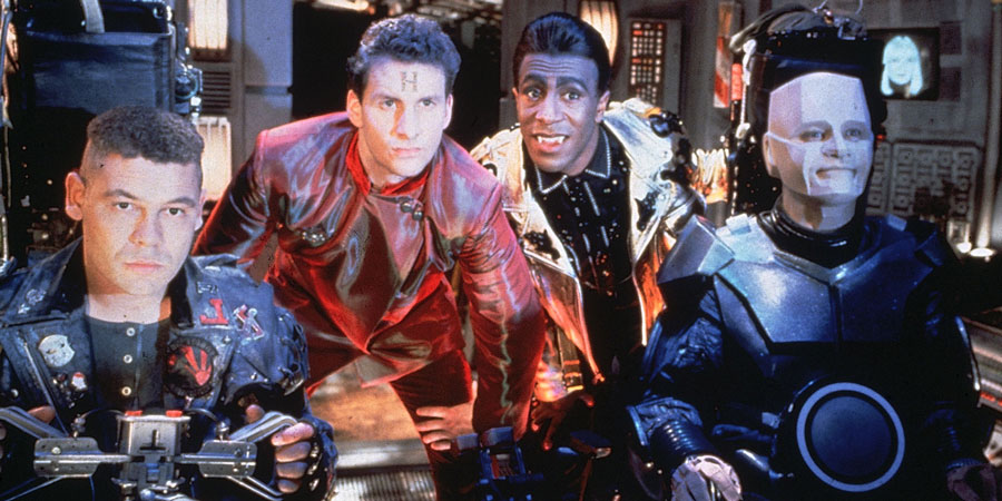 Red Dwarf. Image shows from L to R: Lister (Craig Charles), Rimmer (Chris Barrie), Cat (Danny John-Jules), Kryten (Robert Llewellyn), Holly (Hattie Hayridge). Copyright: Grant Naylor Productions / BBC