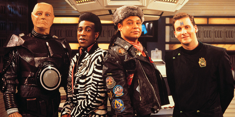 Red Dwarf. Image shows left to right: Kryten (Robert Llewellyn), Cat (Danny John-Jules), Lister (Craig Charles), Rimmer (Chris Barrie)