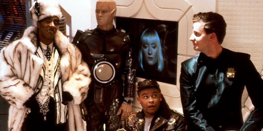 Red Dwarf. Image shows left to right: Cat (Danny John-Jules), Kryten (Robert Llewellyn), Lister (Craig Charles), Holly (Hattie Hayridge), Rimmer (Chris Barrie). Credit: BBC