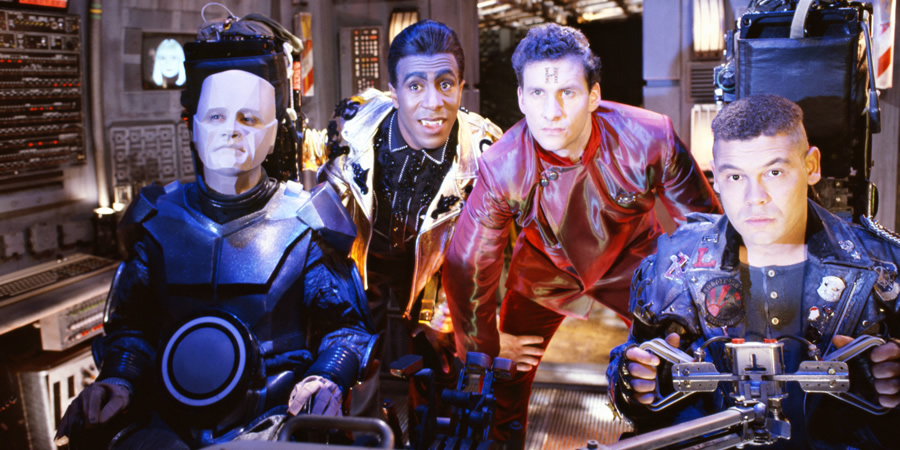Red Dwarf. Image shows from L to R: Kryten (Robert Llewellyn), Cat (Danny John-Jules), Rimmer (Chris Barrie), Lister (Craig Charles). Copyright: BBC