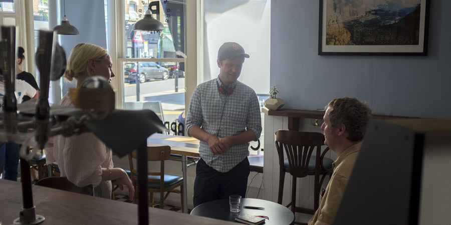 Regular. Image shows from L to R: Barista (Laura Marling), David Elms, Regular (Tim Key)