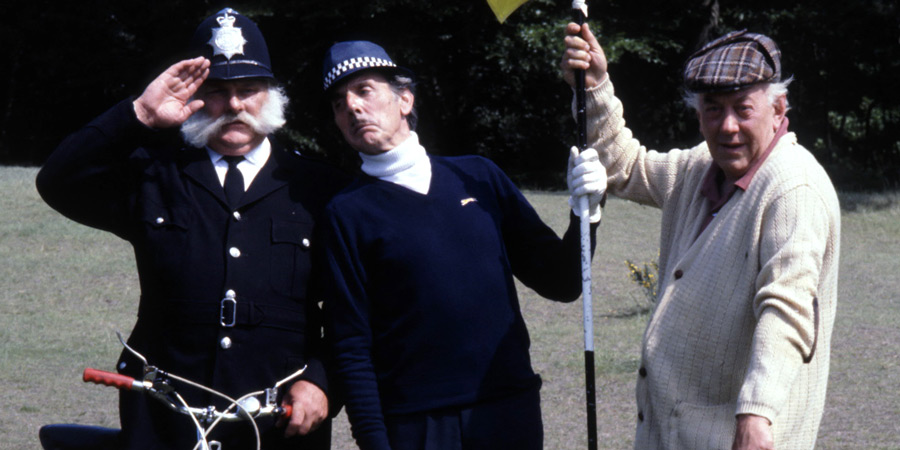 Photograph courtesy of Revelation Films. Image shows from L to R: Police Constable (Jimmy Edwards), Inspector Rhubarb (Eric Sykes), Vicar (Bob Todd). Copyright: Thames Television