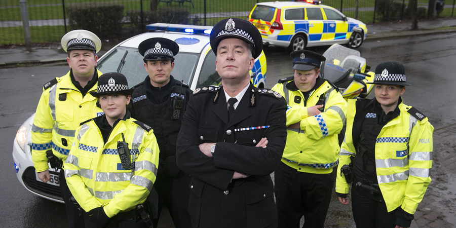 Scot Squad. Image shows from L to R: PC Hugh McKirdy (Graeme Stevely), PC Sarah Fletcher (Sally Reid), PC Jack McLaren (Jordan Young), Chief Commissioner Cameron Miekelson (Jack Docherty), Officer/Acting Sgt. Ken Beattie (James Allenby-Kirk), PC Jane Mackay (Ashley Smith)