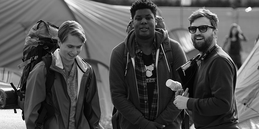 The Festival. Image shows from L to R: Nick (Joe Thomas), Shane (Hammed Animashaun), Iain Morris. Copyright: Fudge Park