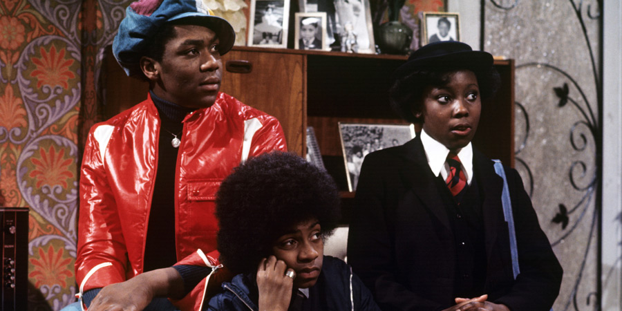 The Fosters. Image shows left to right: Sonny Foster (Lenny Henry), Benjamin Foster (Lawrie Mark), Shirley Foster (Sharon Rosita). Credit: London Weekend Television